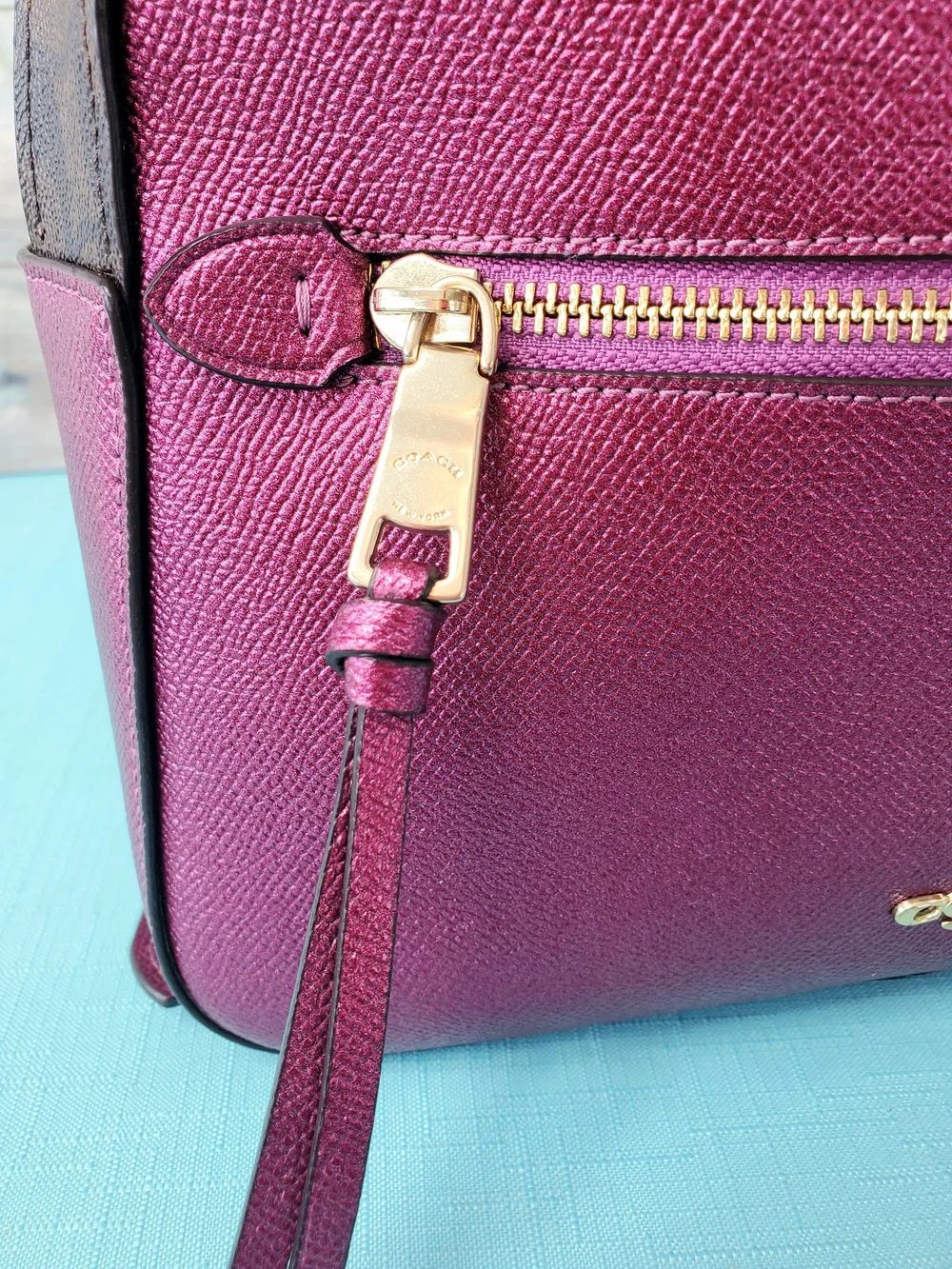 COACH JORDYN BACKPACK IN SIGNATURE CANVAS METALLIC BERRY/BROWN